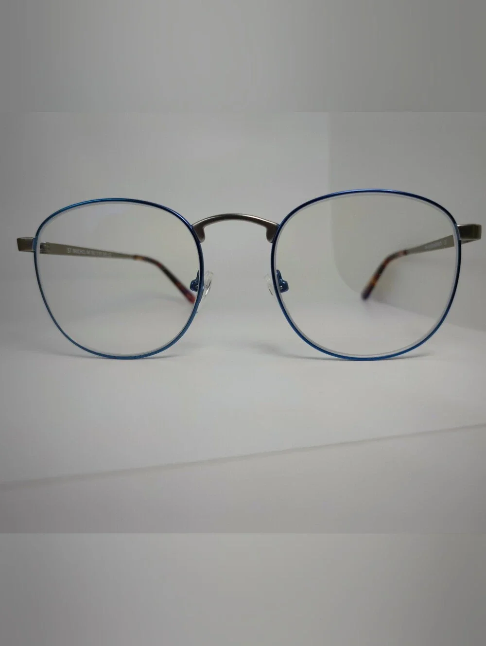 St Michael. Blue Metallic Metal Front Eyewire, Brushed Silver Bridge Temples.